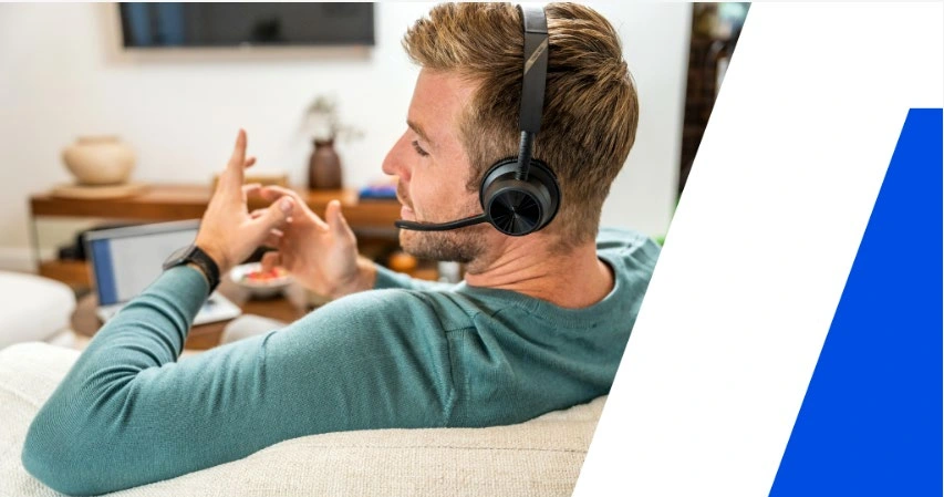 Person wearing a Poly Voyager 4300 Series headset at home